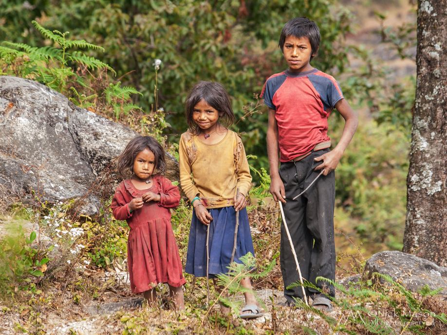 17 Children pause from their games near Syaule