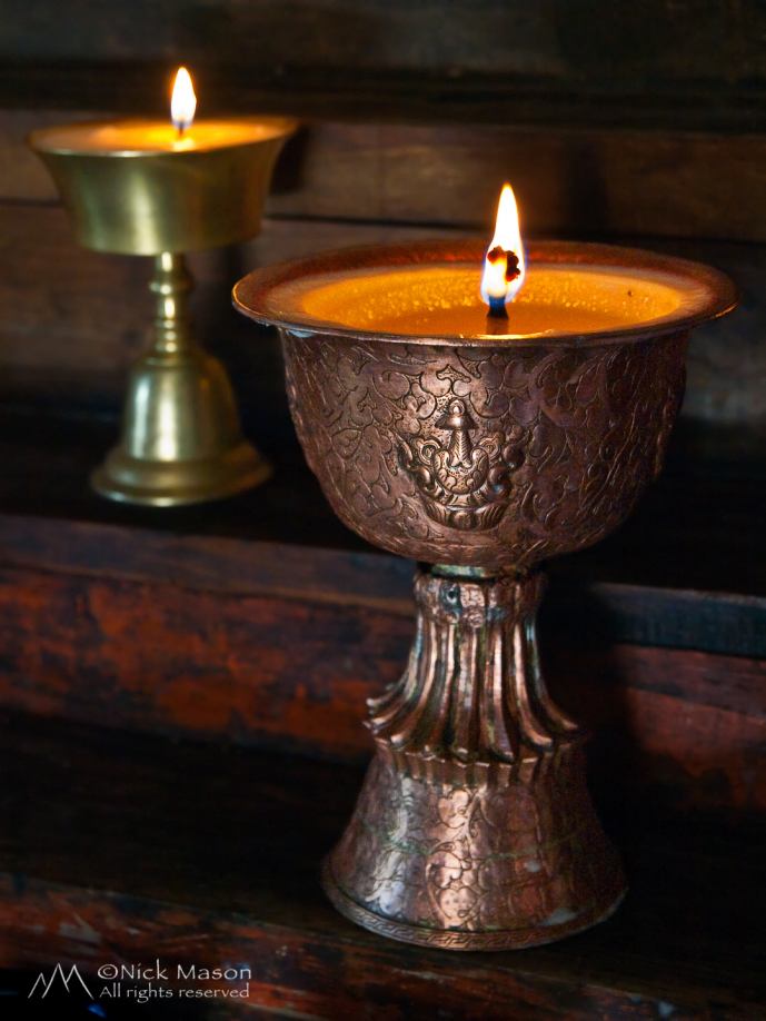 12 Butter lamps in a Buddhist monastery