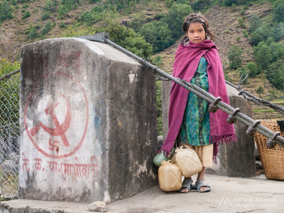 07 A young girl collecting water in the village of Okhreni