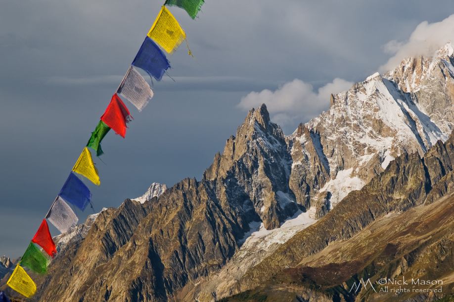 07 Buddhist prayer flags at the Refuge Bonatti frame the Aiguille Noire de Peutery