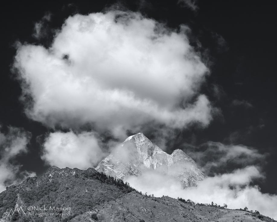 14 Clouds build over Nupla peak above the village of Ghat in the Solukhumbu, Nepal